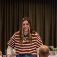 person standing and smiling